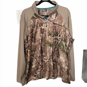 Cabela’s outfit her camouflage shirt.